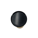 Black top cap of a fuel filter, captured from above